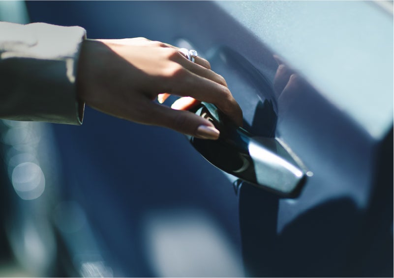 A hand gracefully grips the Light Touch Handle of a 2023 Lincoln Aviator® SUV to demonstrate its ease of use | Gary Yeomans Lincoln Ocala in Ocala FL