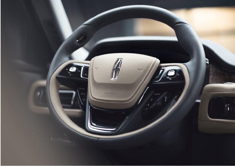 The intuitively placed controls of the steering wheel on a 2023 Lincoln Aviator® SUV | Gary Yeomans Lincoln Ocala in Ocala FL